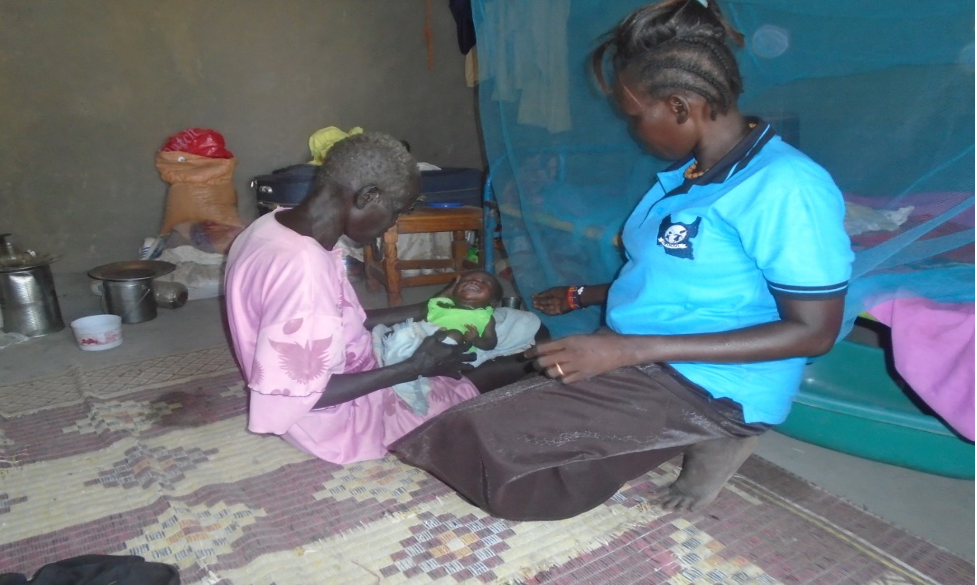 WOCO Caseworker Acquainting the grandmother with the basics of keeping hygiene during child rearing stage.  